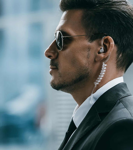 Bodyguard with sunglasses and ear piece